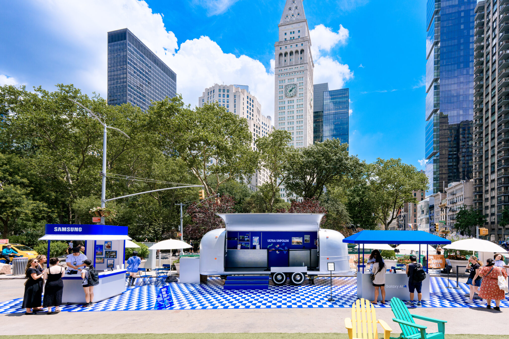 Samsung Galaxy Hangouts installation with blue and white ground graphics and a branded trailer at Flatiron Plaza
